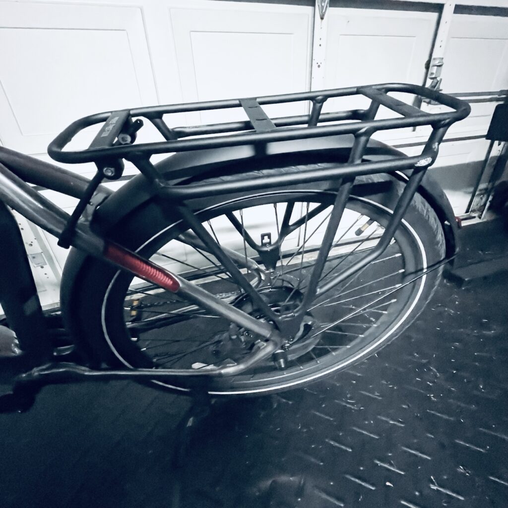 An empty rear rack of an Aventon Level 2 eBike, ready to be fitted with the best eBike accessories.