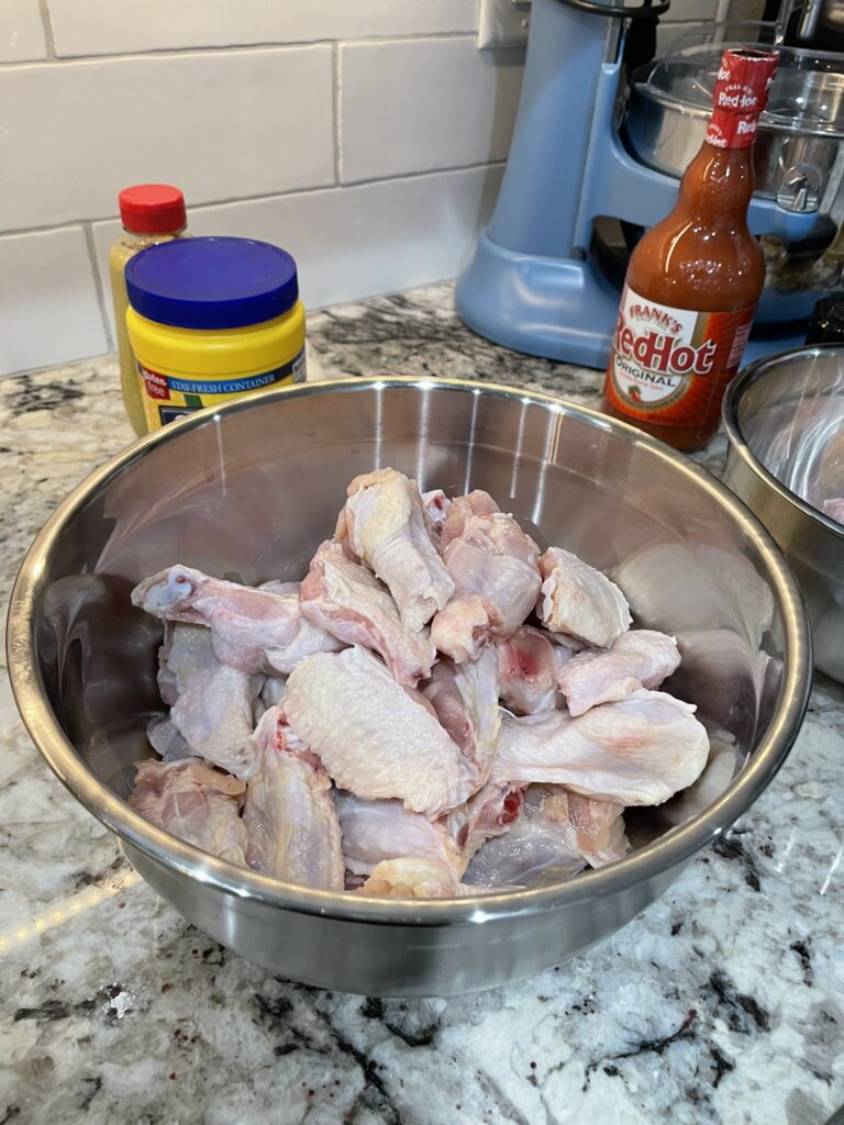 Crispy smoked chicken wings - trimmed wings in a bowl ready for smoking.