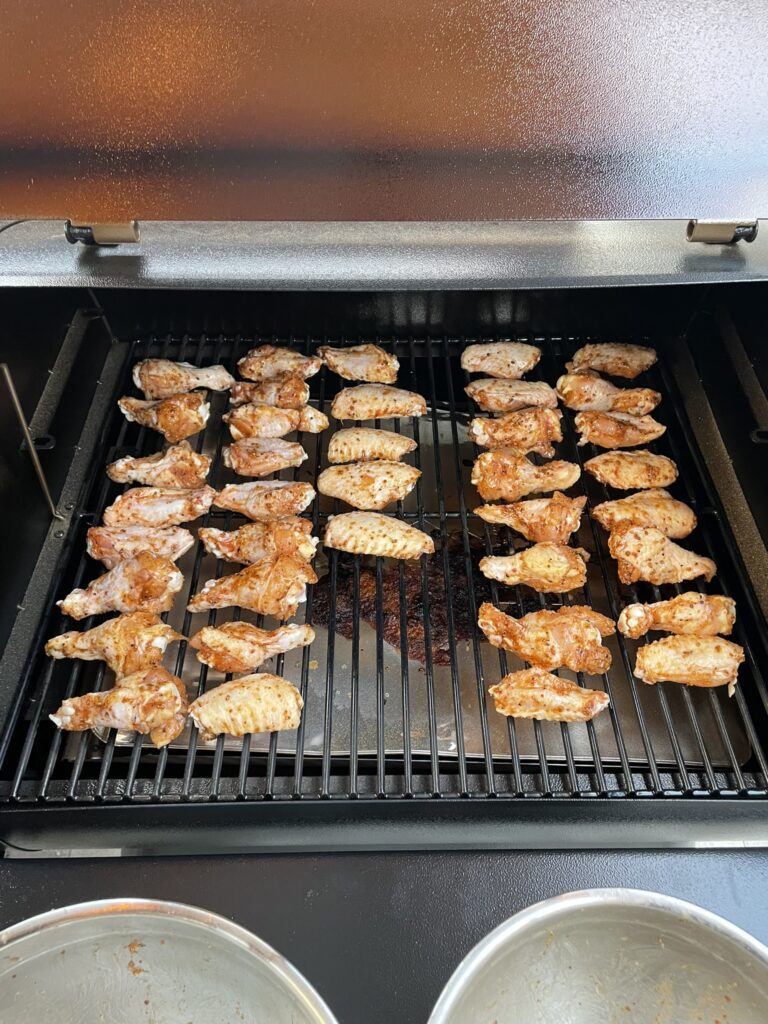 Crispy smoked chicken wings - a close-up view of wings on Traeger grill.