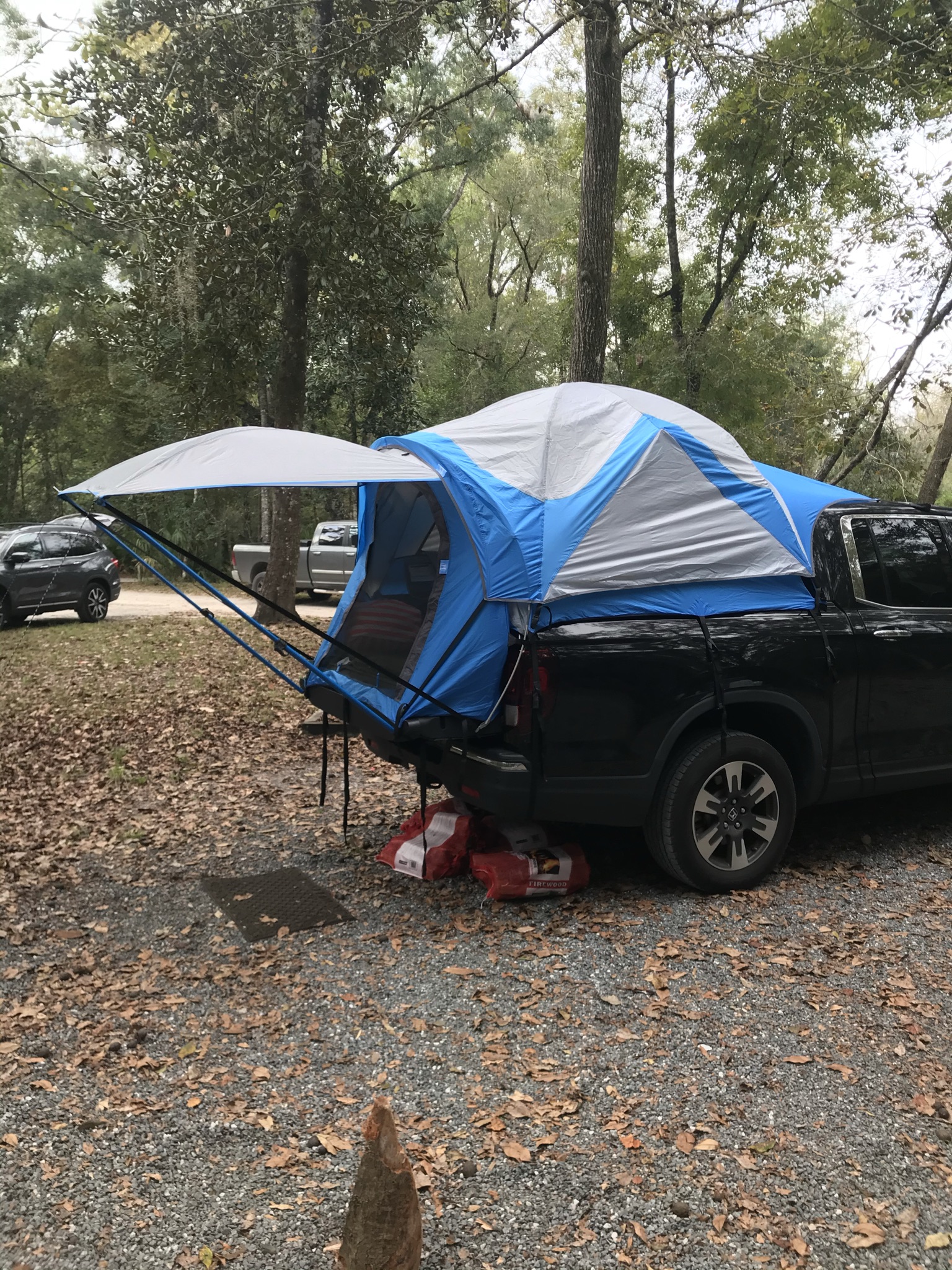 A truck outfitted with a tent setup, exemplifying the adventurous spirit of truck camping escapades.