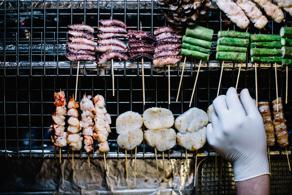 Highly appetizing food perfectly grilled on the Robatayaki grill at Double Knot, an acclaimed Japanese restaurant in Philadelphia and considered one of the best Japanese restaurants near me.