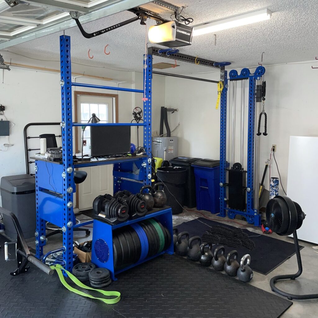 More half garage gym ideas with adjustable dumbbells and plate storage banch