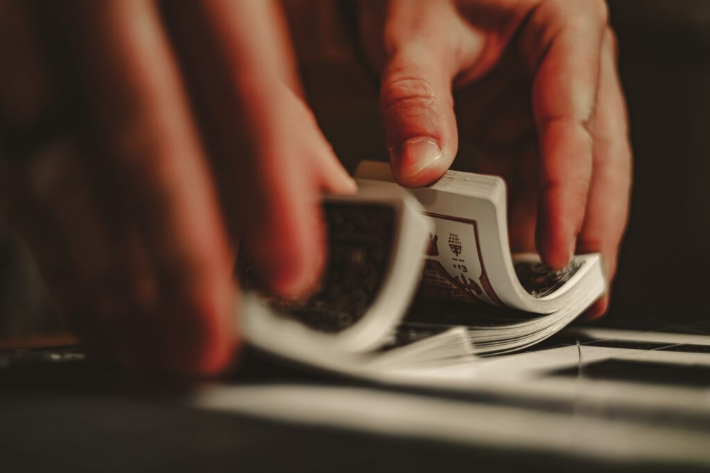 Cards being shuffled before a cribbage game, a crucial step before dealing to determine flushes in cribbage and understand 'what is a flush in cribbage