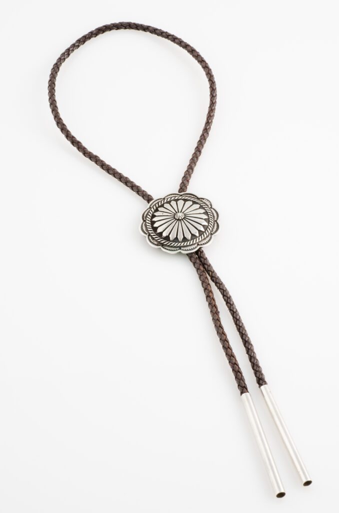 Close-up view of a bolo tie, emphasizing the elegance of what bolo ties bring.