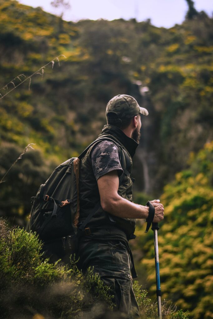 Man hiking with one of the best travel backpacks for men, a fusion of comfort and utility.