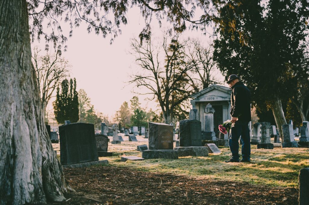 Man mourning at funeral service following the Mike Mentzer death