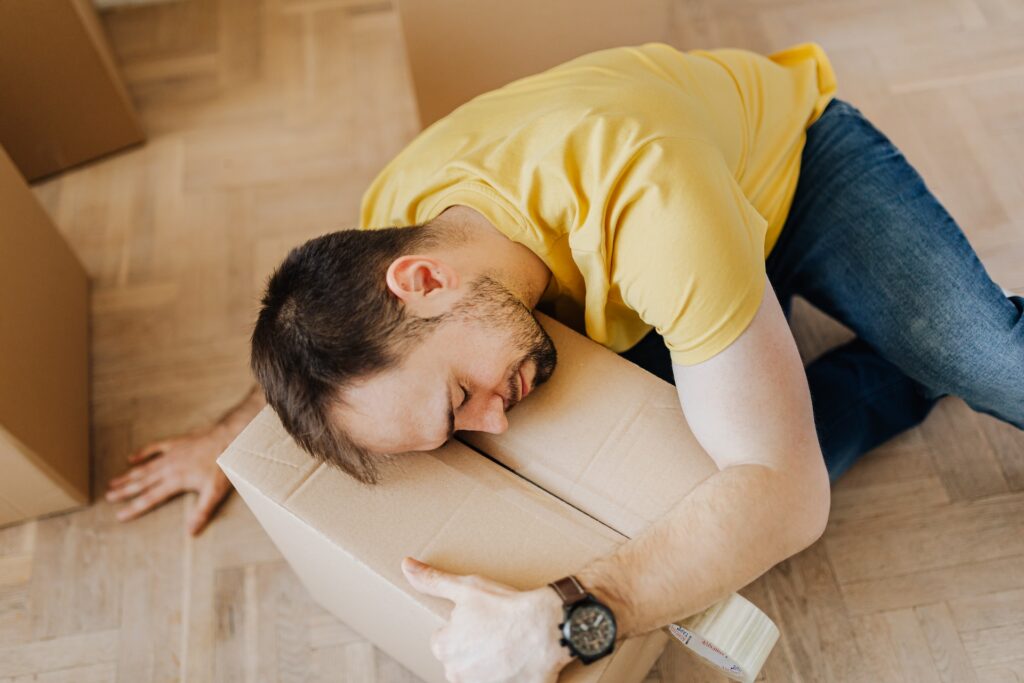 Man sleeping in one of the worst sleeping positions for lower back pain