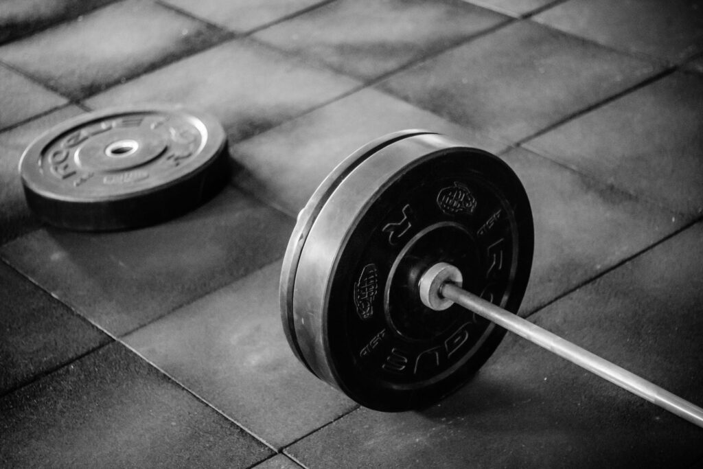 Barbell setup for the landmine press, an exercise for enhancing overall strength, balance, and core stability.