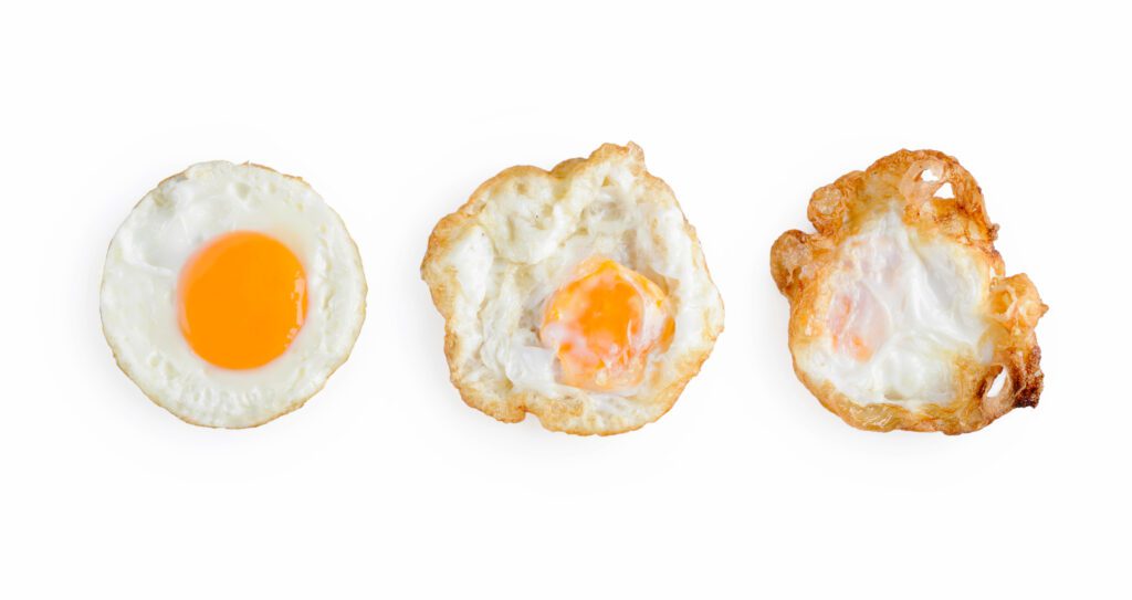 Visual comparison of sunny side up, over easy, and over hard eggs, showcasing the difference in appearance and texture of eggs over hard.