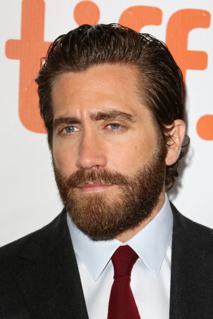 Jake Gyllenhaal showcasing medium beard styles, displaying a full beard for men.